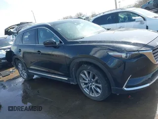 2020 Mazda CX-9 Grand Touring with VIN JM3TCBDY2L0413839, listed as a IAAI auction lot 41720713 with 48,964 mi miles and . Bid and sale history available at DreamBid. Image 14.
