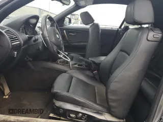 2012 BMW 1 Series 135i with VIN WBAUN7C59CVM26082, listed as a Copart auction lot 74711754 with 77,152 mi miles and Salvage title. Bid and sale history available at DreamBid. Image 7.