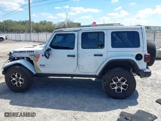 2021 Jeep Wrangler Unlimited Rubicon with VIN 1C4HJXFN9MW519496, listed as a IAAI auction lot 41676845 with 72,767 mi miles. Bid and sale history available at carsss.com. Image 14.