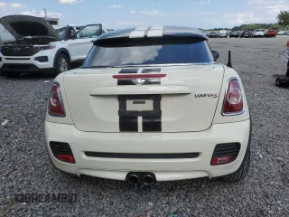 2012 MINI Coupe S z VIN WMWSX3C56CT154872, wystawiony jako Copart lot #68011264 z przebiegiem 91 650 mil mil oraz Szkody całkowita. Historia ofert i sprzedaży dostępna na DreamBid. Obrazek 6.