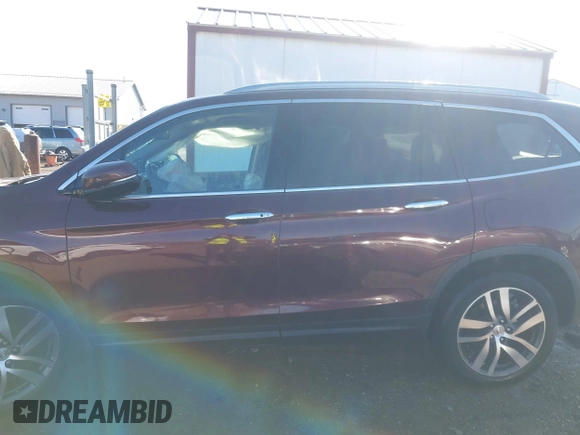 2016 Honda Pilot Touring with VIN 5FNYF6H90GB126572, listed as a IAAI auction lot 41872113 with 94,318 mi miles. Bid and sale history available at carsss.com. Image 14.