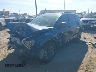 2024 Kia Sportage SX-Prestige with VIN KNDPXCDG0R7124647, listed as a IAAI auction lot 41058974 with 16,436 mi miles and . Bid and sale history available at DreamBid. Image 2.