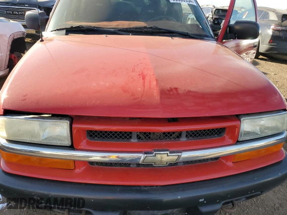 2004 Chevrolet Blazer LS z VIN 1GNCT18X34K141674, wystawiony jako Copart lot #85500954 z przebiegiem Nie podano mil oraz Czysty tytuł • Clean title. Historia ofert i sprzedaży dostępna na DreamBid. Obrazek 11.