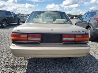 1991 Toyota Camry DLX z VIN 4T1SV21E5MU415356, wystawiony jako Copart lot #74465914 z przebiegiem 74 592 mil mil oraz Szkoda całkowita • Salvage title. Historia ofert i sprzedaży dostępna na DreamBid. Obrazek 6.