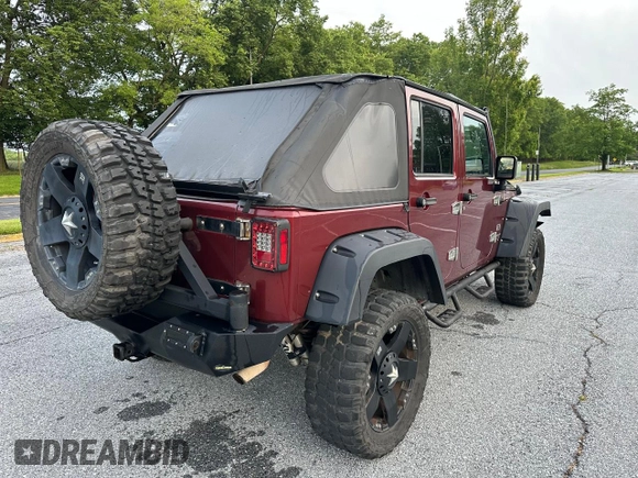 2007 Jeep Wrangler Unlimited X with VIN 1J8GA39147L156911, listed as a Copart auction lot 65987405 with 115,766 mi miles and Clean title. Bid and sale history available at DreamBid. Image 4.