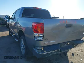 2012 Toyota Tundra 4WD Truck LTD with VIN 5TFHW5F18CX251584, listed as a IAAI auction lot 41054238 with 124,892 mi miles. Bid and sale history available at carsss.com. Image 3.