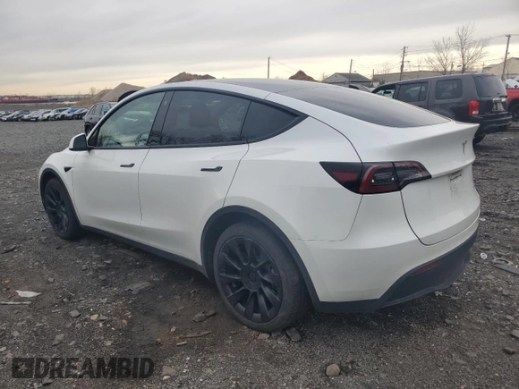 2023 Tesla Model Y Long Range with VIN 7SAYGDEE0PF746778, listed as a Copart auction lot 52704965 with 19,047 mi miles and Salvage Title. Bid and sale history available at DreamBid. Image 2.