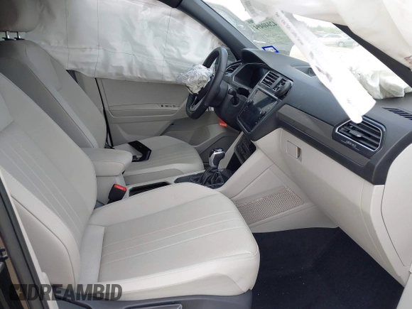 2023 Volkswagen Tiguan SE R-Line Black with VIN 3VVCB7AX0PM122636, listed as a IAAI auction lot 42040494 with 8,589 mi miles and . Bid and sale history available at DreamBid. Image 5.