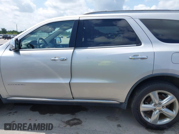 2013 Dodge Durango Citadel with VIN 1C4RDHEG0DC571833, listed as a IAAI auction lot 42736033 with 110,808 mi miles and . Bid and sale history available at DreamBid. Image 14.