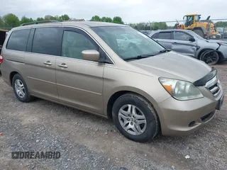 2005 Honda Odyssey EX-L z VIN 5FNRL38635B412107, wystawiony jako IAAI lot #42255584 z przebiegiem 158 022 mil mil oraz . Historia ofert i sprzedaży dostępna na DreamBid. Obrazek 1.