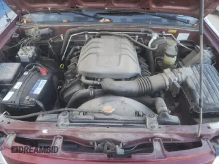 2002 Isuzu Rodeo S with VIN 4S2DM58W824313096, listed as a Copart auction lot 77951364 with 127,470 mi miles and Salvage Title. Bid and sale history available at DreamBid. Image 12.