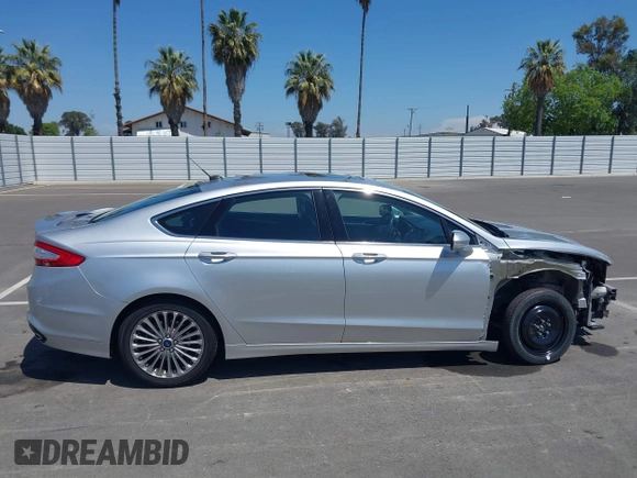 2014 Ford Fusion Titanium with VIN 3FA6P0K96ER248025, listed as a IAAI auction lot 42189061 with 64,351 mi miles and . Bid and sale history available at DreamBid. Image 14.