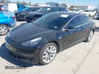 2020 Tesla Model 3 Standard Range Plus with VIN 5YJ3E1EAXLF614002, listed as a IAAI auction lot 41758898 with 42,363 mi miles and . Bid and sale history available at DreamBid. Image 22.