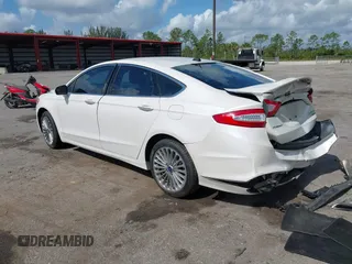2016 Ford Fusion Titanium with VIN 3FA6P0K96GR400436, listed as a IAAI auction lot 42191256 with 128,447 mi miles and . Bid and sale history available at DreamBid. Image 3.