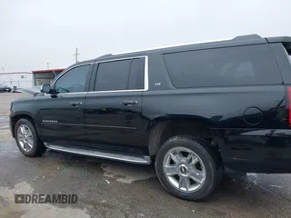 2015 Chevrolet Suburban LTZ with VIN 1GNSCKKC6FR271675, listed as a IAAI auction lot 41915036 with 150,917 mi miles. Bid and sale history available at carsss.com. Image 14.