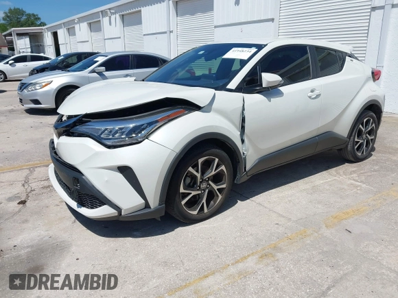 2021 Toyota C-HR LE with VIN JTNKHMBX8M1104427, listed as a IAAI auction lot 41948234 with 24,415 mi miles. Bid and sale history available at carsss.com. Image 2.