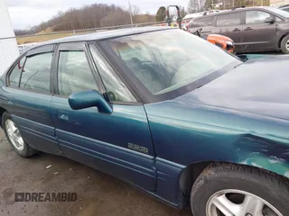 1996 Pontiac Bonneville z VIN 1G2HZ5210TH210829, wystawiony jako IAAI lot #41203888 z przebiegiem 154 990 mil mil oraz . Historia ofert i sprzedaży dostępna na DreamBid. Obrazek 13.