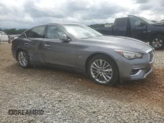 2019 Infiniti Q50 Luxe with VIN JN1EV7AP6KM517944, listed as a Copart auction lot 56942655 with 94,883 mi miles and Salvage title. Bid and sale history available at DreamBid. Image 4.
