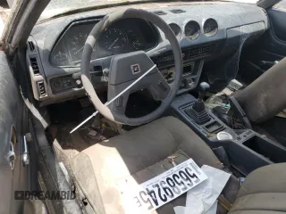 1981 Datsun 280ZX z VIN JN1HZ04SDBX265650, wystawiony jako Copart lot #56589245 z przebiegiem 147 572 mil mil oraz Nie do naprawy • Non repairable. Historia ofert i sprzedaży dostępna na DreamBid. Obrazek 8.