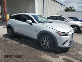 2017 Mazda CX-3 Touring z VIN JM1DKDC78H0150588, wystawiony jako Copart lot #55284205 z przebiegiem 78 923 mil mil oraz Szkoda całkowita • Salvage title. Historia ofert i sprzedaży dostępna na DreamBid. Obrazek 4.