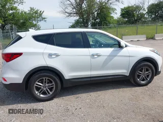 2017 Hyundai Santa Fe 2.4L with VIN 5NMZTDLB5HH018198, listed as a IAAI auction lot 42523632 with 144,883 mi miles and . Bid and sale history available at DreamBid. Image 14.