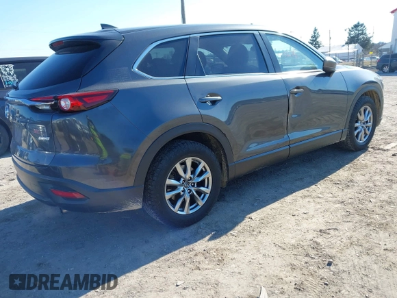 2016 Mazda CX-9 Sport with VIN JM3TCBBY8G0118088, listed as a IAAI auction lot 41710275 with 128,400 mi miles. Bid and sale history available at carsss.com. Image 4.