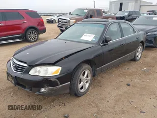 2001 Mazda Millenia z VIN JM1TA221711710228, wystawiony jako IAAI lot #41435837 z przebiegiem 152 445 mil mil oraz . Historia ofert i sprzedaży dostępna na DreamBid. Obrazek 2.
