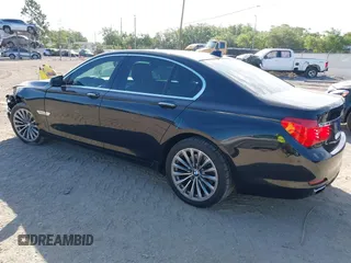 2012 BMW 7 Series 740i with VIN WBAKA4C51CC613636, listed as a IAAI auction lot 41908801 with 127,725 mi miles and . Bid and sale history available at carsss.com. Image 3.