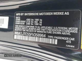 2015 BMW 2 Series M235i with VIN WBA1J7C55FV358964, listed as a IAAI auction lot 41674800 with 63,504 mi miles and . Bid and sale history available at carsss.com. Image 9.