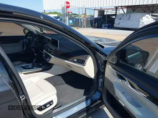 2016 BMW 7 Series 740i with VIN WBA7E2C55GG547752, listed as a IAAI auction lot 41992704 with Not Provided miles and . Bid and sale history available at carsss.com. Image 5.