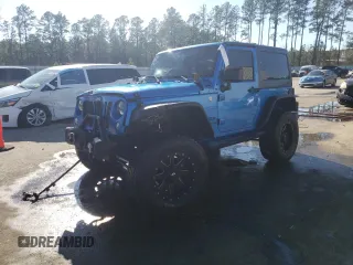 2015 Jeep Wrangler Freedom Edition with VIN 1C4AJWAG7FL555325, listed as a Copart auction lot 46517755 with 125,171 mi miles and Salvage title. Bid and sale history available at DreamBid. Image 1.
