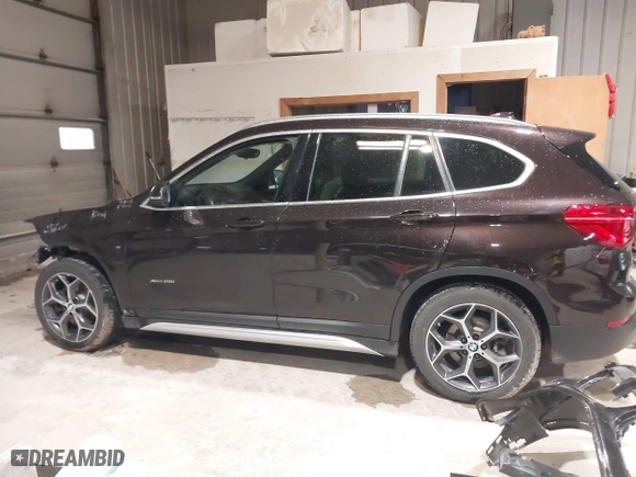 2016 BMW X1 xDrive28i with VIN WBXHT3C33GP886935, listed as a IAAI auction lot 41707367 with 73,201 mi miles. Bid and sale history available at carsss.com. Image 15.