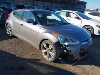 2017 Hyundai Veloster with VIN KMHTC6ADXHU323934, listed as a IAAI auction lot 41335240 with 99,008 mi miles. Bid and sale history available at carsss.com. Image 1.