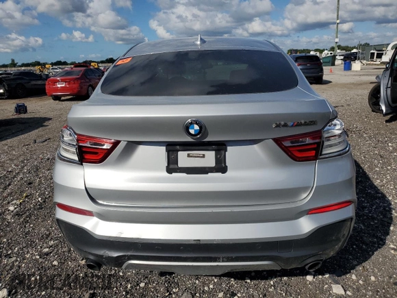 2017 BMW X4 M40i with VIN 5UXXW7C51H0U25511, listed as a Copart auction lot 77492894 with 94,003 mi miles and Salvage Title. Bid and sale history available at carsss.com. Image 6.