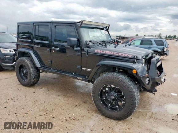 2015 Jeep Wrangler Unlimited Rubicon Hard Rock with VIN 1C4HJWFG1FL710264, listed as a Copart auction lot 54123285 with 96,737 mi miles and Salvage title. Bid and sale history available at DreamBid. Image 4.