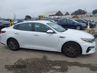 2019 Kia Optima LX with VIN 5XXGT4L35KG324274, listed as a IAAI auction lot 42111177 with 126,494 mi miles. Bid and sale history available at carsss.com. Image 13.