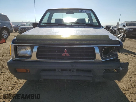1994 Mitsubishi Mighty Max z VIN JA7LS21G4RP009588, wystawiony jako Copart lot #60519834 z przebiegiem 123 918 mil mil oraz Szkoda całkowita • Salvage title. Historia ofert i sprzedaży dostępna na DreamBid. Obrazek 5.