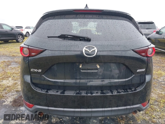 2018 Mazda CX-5 Touring with VIN JM3KFACM0J0315739, listed as a IAAI auction lot 40516262 with 60,727 mi miles. Bid and sale history available at carsss.com. Image 16.