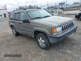 1995 Jeep Grand Cherokee Laredo with VIN 1J4GZ58S4SC555309, listed as a IAAI auction lot 41600141 with 130,493 mi miles. Bid and sale history available at carsss.com. Image 1.