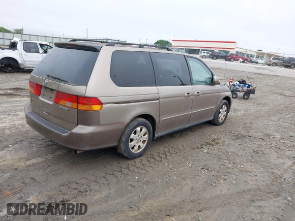 2004 Honda Odyssey EX-L z VIN 5FNRL189X4B036406, wystawiony jako IAAI lot #42368037 z przebiegiem 177 513 mil mil oraz . Historia ofert i sprzedaży dostępna na DreamBid. Obrazek 4.