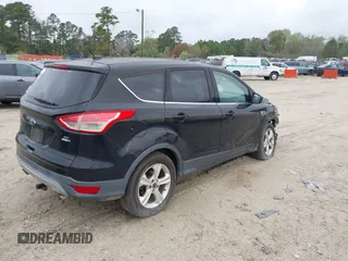 2016 Ford Escape SE with VIN 1FMCU9G99GUC13053, listed as a IAAI auction lot 41888535 with 84,019 mi miles. Bid and sale history available at carsss.com. Image 4.