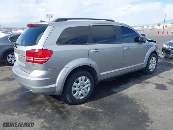 2016 Dodge Journey SE with VIN 3C4PDCAB0GT230512, listed as a IAAI auction lot 41434785 with 140,829 mi miles. Bid and sale history available at carsss.com. Image 4.