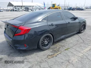 2021 Honda Civic Sport with VIN 2HGFC2F88MH557221, listed as a IAAI auction lot 42161778 with 101,956 mi miles and . Bid and sale history available at DreamBid. Image 4.