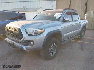 2018 Toyota Tacoma SR with VIN 3TMCZ5AN1JM141605, listed as a IAAI auction lot 41558201 with 91,855 mi miles. Bid and sale history available at carsss.com. Image 2.