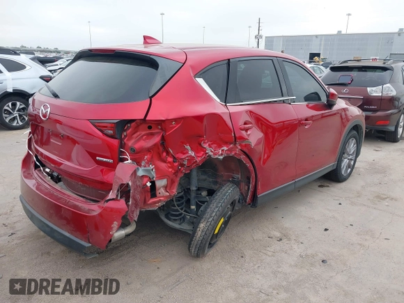 2020 Mazda CX-5 Grand Touring with VIN JM3KFADM7L0729537, listed as a IAAI auction lot 41864569 with 82,998 mi miles. Bid and sale history available at carsss.com. Image 4.
