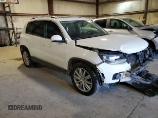 2012 Volkswagen Tiguan SE with VIN WVGAV7AX8CW533592, listed as a Copart auction lot 43246395 with 149,928 mi miles and Salvage Title. Bid and sale history available at DreamBid. Image 4.