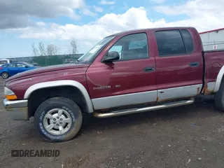 2002 Dodge Dakota z VIN 1B7HG48X92S626936, wystawiony jako IAAI lot #42192429 z przebiegiem 170 746 mil mil oraz . Historia ofert i sprzedaży dostępna na DreamBid. Obrazek 6.