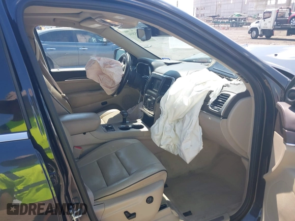 2015 Jeep Grand Cherokee High Altitude with VIN 1C4RJFCG5FC807394, listed as a IAAI auction lot 42452034 with 72,011 mi miles and . Bid and sale history available at DreamBid. Image 5.