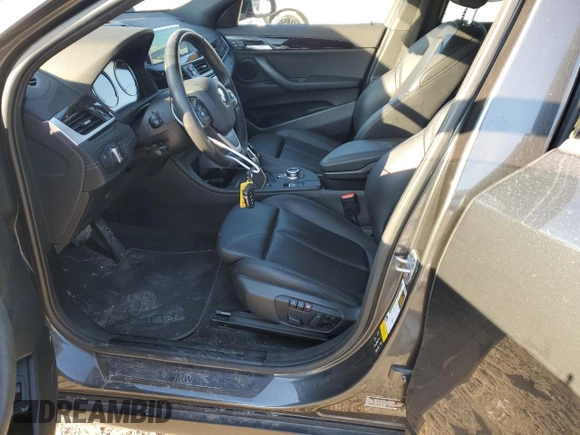2020 BMW X2 xDrive28i with VIN WBXYJ1C00L5P51384, listed as a Copart auction lot 87406814 with 52,807 mi miles and Salvage Title. Bid and sale history available at carsss.com. Image 7.