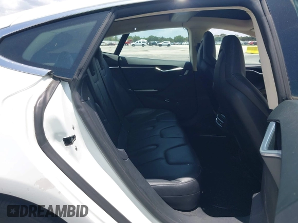 2013 Tesla Model S with VIN 5YJSA1CG4DFP21658, listed as a IAAI auction lot 42398609 with 116,068 mi miles and . Bid and sale history available at DreamBid. Image 8.